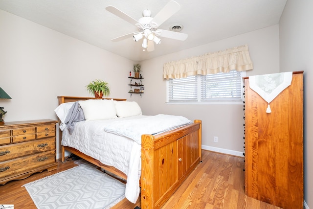 bedroom with ceiling fan and light wood-type flooring