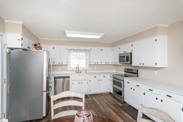 kitchen with white cabinetry, sink, a textured ceiling, and appliances with stainless steel finishes