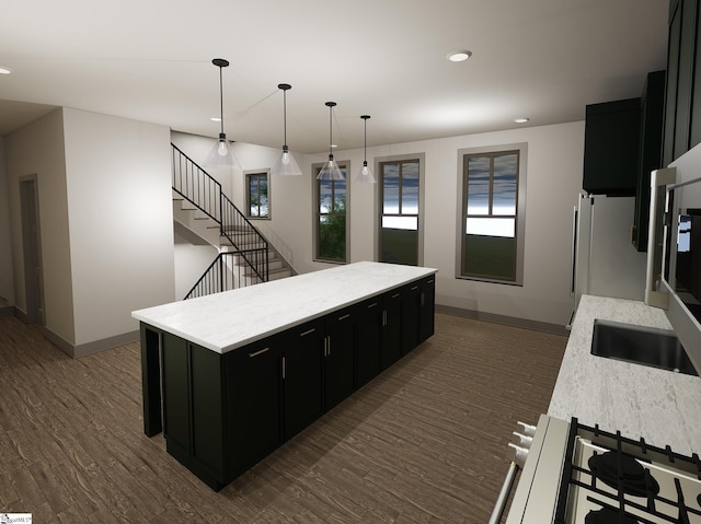 kitchen featuring a center island, pendant lighting, stainless steel fridge, and dark hardwood / wood-style flooring