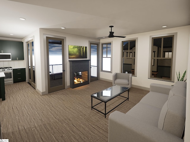 living room with ceiling fan and wood-type flooring