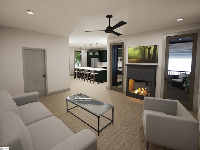 living room with ceiling fan and a fireplace