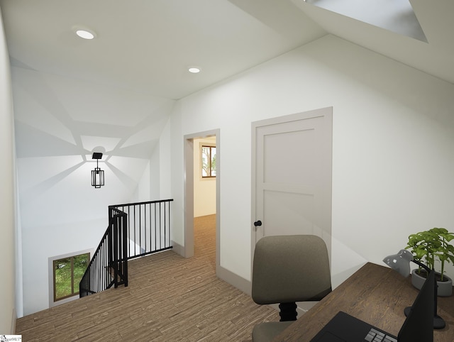 office with hardwood / wood-style flooring and lofted ceiling