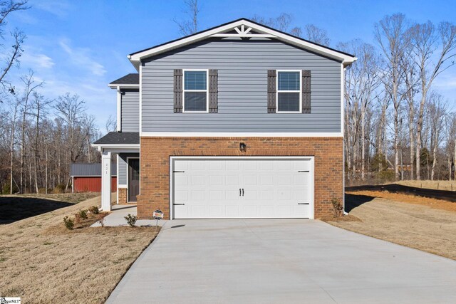 421 Haddon Trl Lot 58, Woodruff, SC 29388 - view of front of home with brick siding, driveway, and a garage