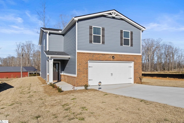 421 Haddon Trl Lot 58, Woodruff, SC 29388 - view of front of house featuring brick siding, an attached garage, and concrete driveway