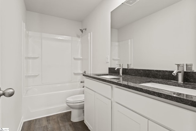 421 Haddon Trl Lot 58, Woodruff, SC 29388 - full bath with double vanity, toilet, wood finished floors, and shower / bathtub combination