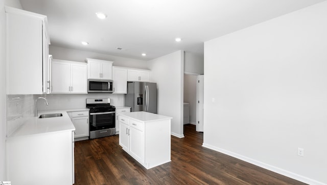305 Lodestone Rd Lot 0267, Simpsonville, SC 29680 - kitchen featuring a center island, dark wood-style floors, stainless steel appliances, and a sink