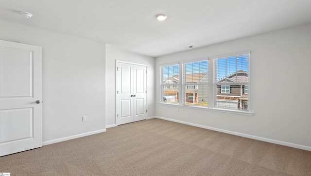 305 Lodestone Rd Lot 0267, Simpsonville, SC 29680 - unfurnished bedroom featuring visible vents, baseboards, carpet flooring, and a closet