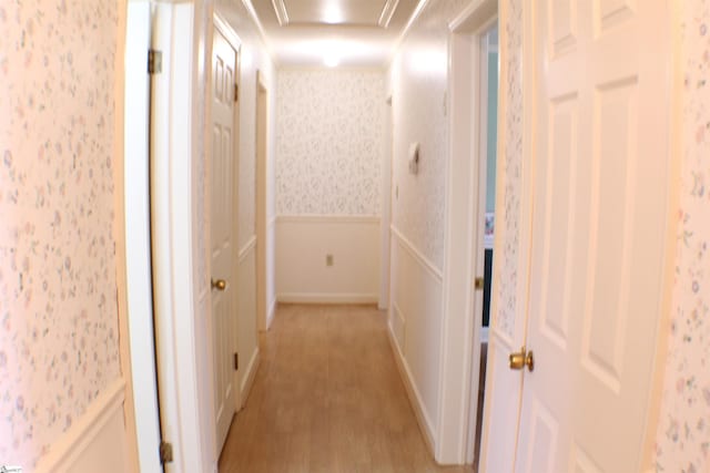 corridor featuring light hardwood / wood-style flooring