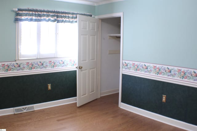 unfurnished bedroom featuring wood-type flooring