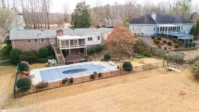 exterior space featuring a patio area and a sunroom