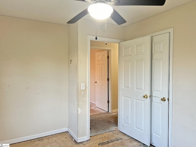 unfurnished bedroom with a closet and ceiling fan