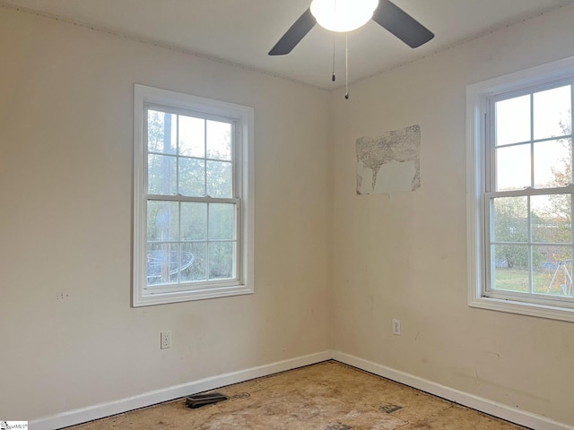 empty room with plenty of natural light and ceiling fan