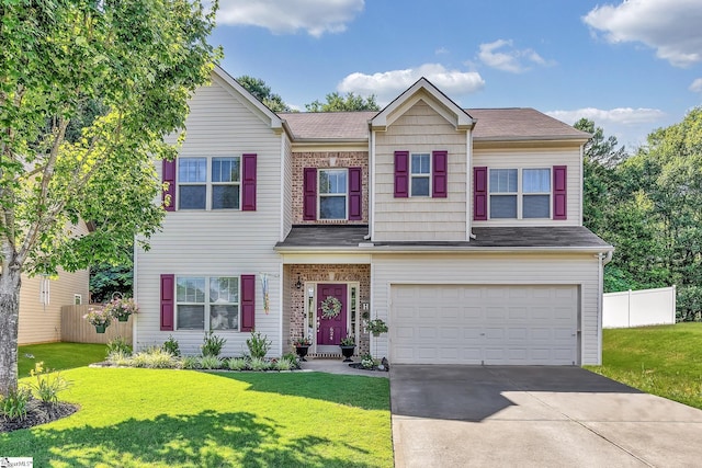 view of front of property with a garage and a front yard