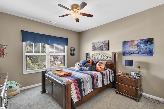 bedroom with light colored carpet and ceiling fan