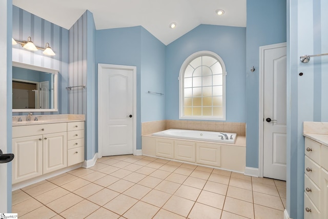 bathroom featuring tile patterned flooring, lofted ceiling, and a bath