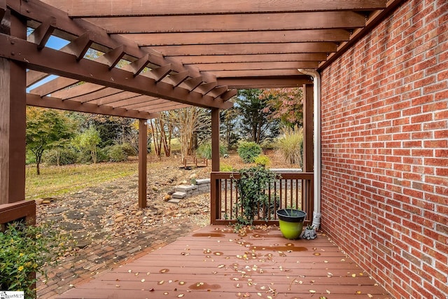 wooden deck featuring a pergola