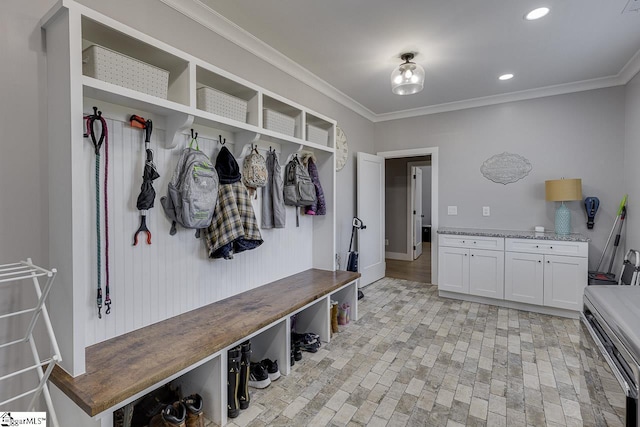 mudroom featuring ornamental molding