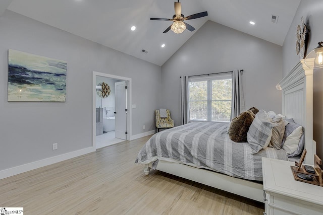 bedroom with high vaulted ceiling, ceiling fan, light hardwood / wood-style floors, and connected bathroom