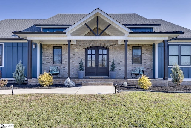 property entrance with a porch and a yard