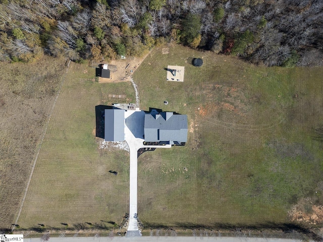 birds eye view of property with a rural view