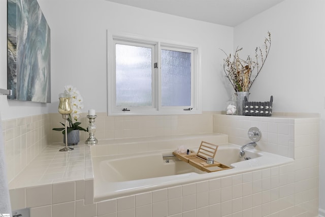 bathroom with tiled bath