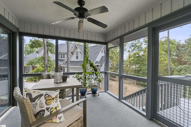 sunroom / solarium with ceiling fan