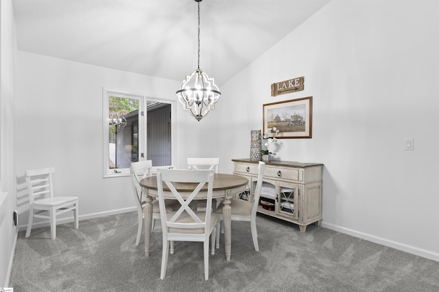 carpeted dining space featuring high vaulted ceiling and a notable chandelier