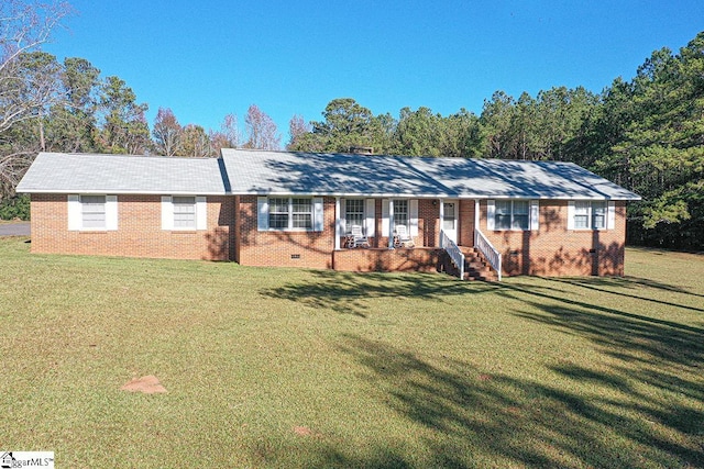 ranch-style home featuring a porch and a front yard