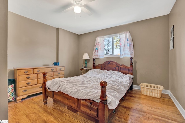 bedroom with hardwood / wood-style floors and ceiling fan