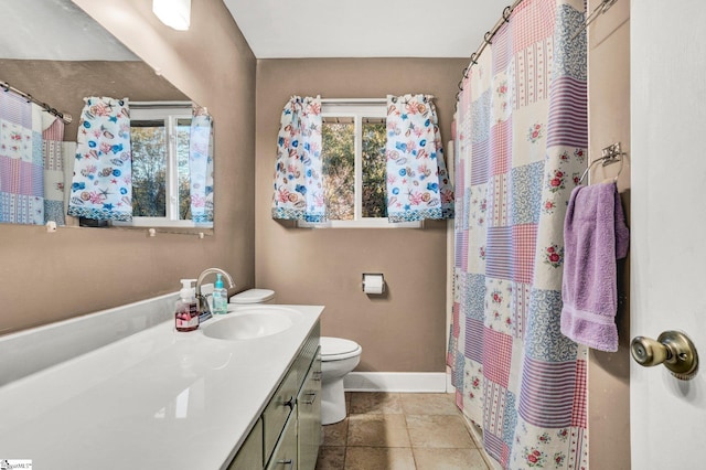 bathroom featuring tile patterned flooring, vanity, toilet, and a shower with curtain