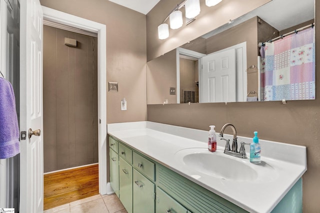 bathroom with tile patterned floors and vanity