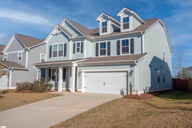 view of front of home featuring a front yard and a garage