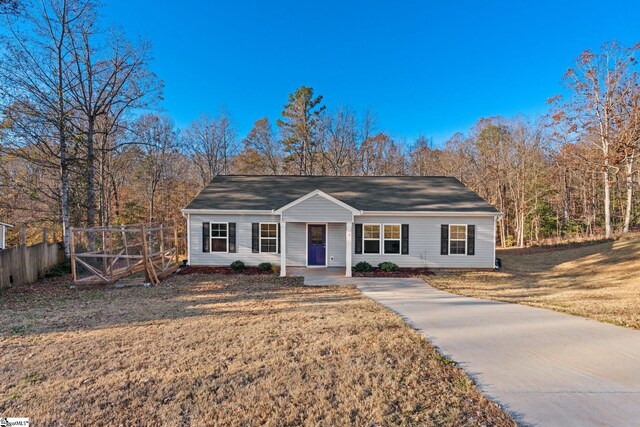 ranch-style home with a front yard