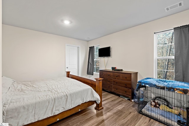 bedroom with hardwood / wood-style floors