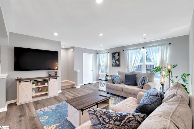 living room with light hardwood / wood-style flooring