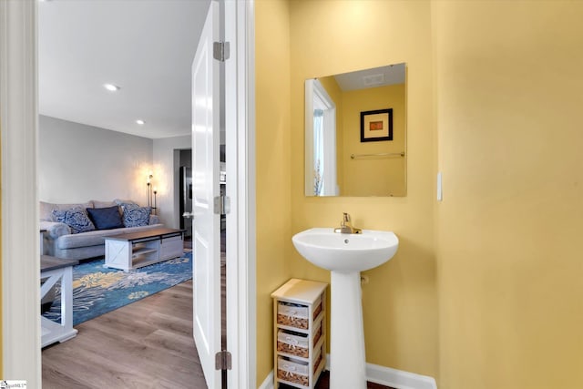 bathroom featuring hardwood / wood-style flooring and sink