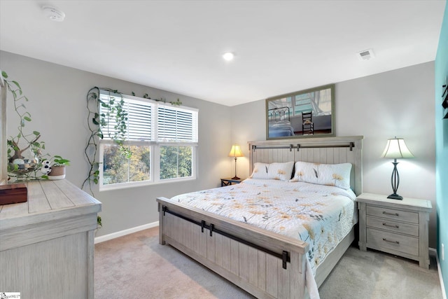 bedroom with light colored carpet