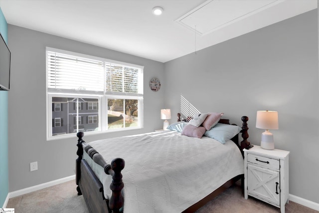 bedroom with light colored carpet