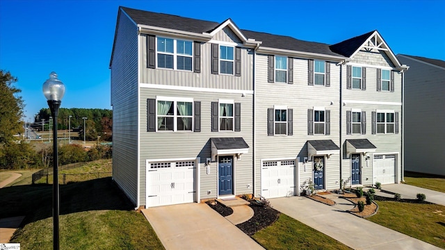 townhome / multi-family property featuring a garage