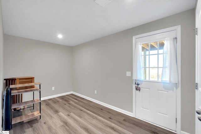 doorway with light hardwood / wood-style floors