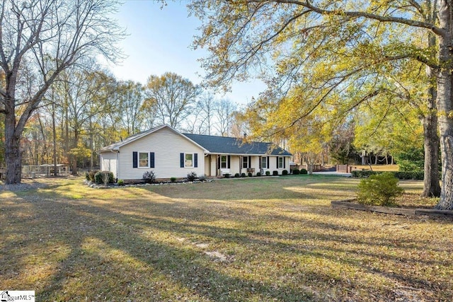 ranch-style home with a front yard