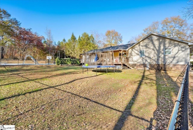 view of yard with a trampoline