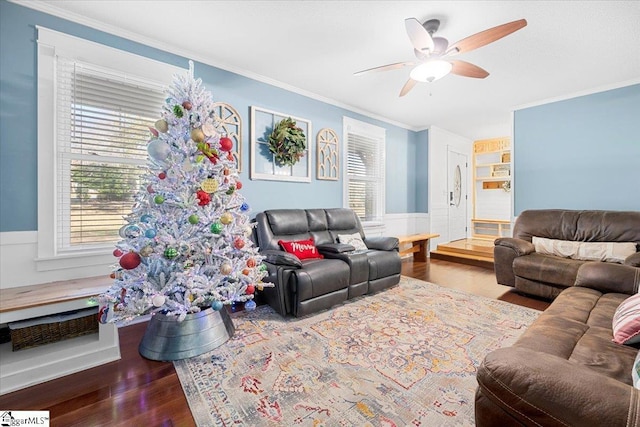 living room with ceiling fan, dark hardwood / wood-style floors, and ornamental molding