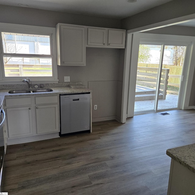 kitchen with white cabinetry, stainless steel dishwasher, a healthy amount of sunlight, and sink