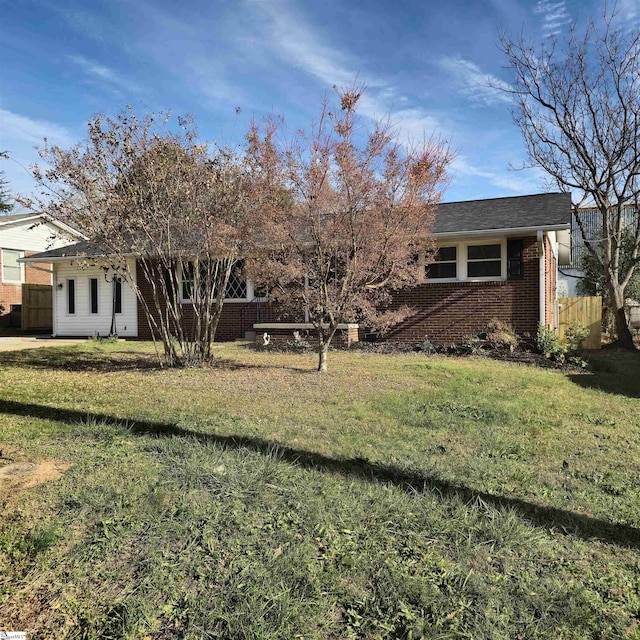 rear view of house with a lawn