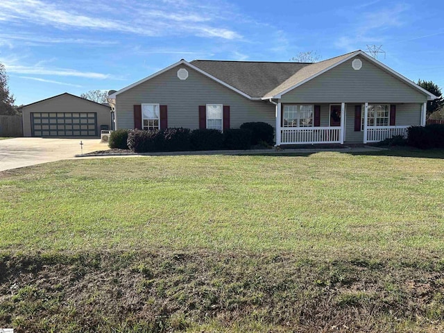 single story home featuring a porch, a front yard, an outdoor structure, and a garage