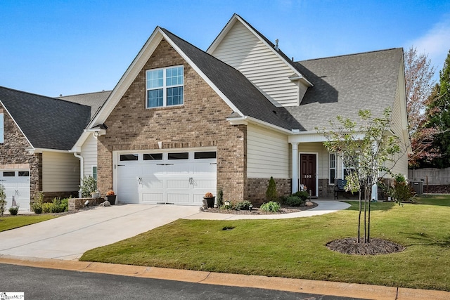 craftsman house featuring a front lawn and a garage