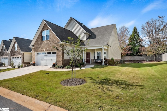 view of front of property with a front yard, a garage, and central AC unit