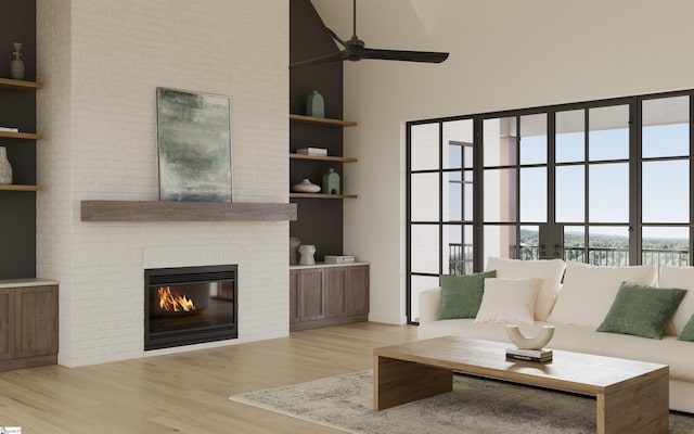 unfurnished living room with built in shelves, ceiling fan, light wood-type flooring, and a fireplace