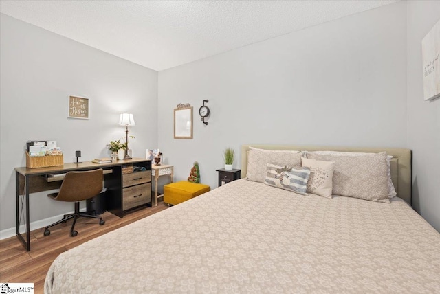 bedroom featuring wood-type flooring